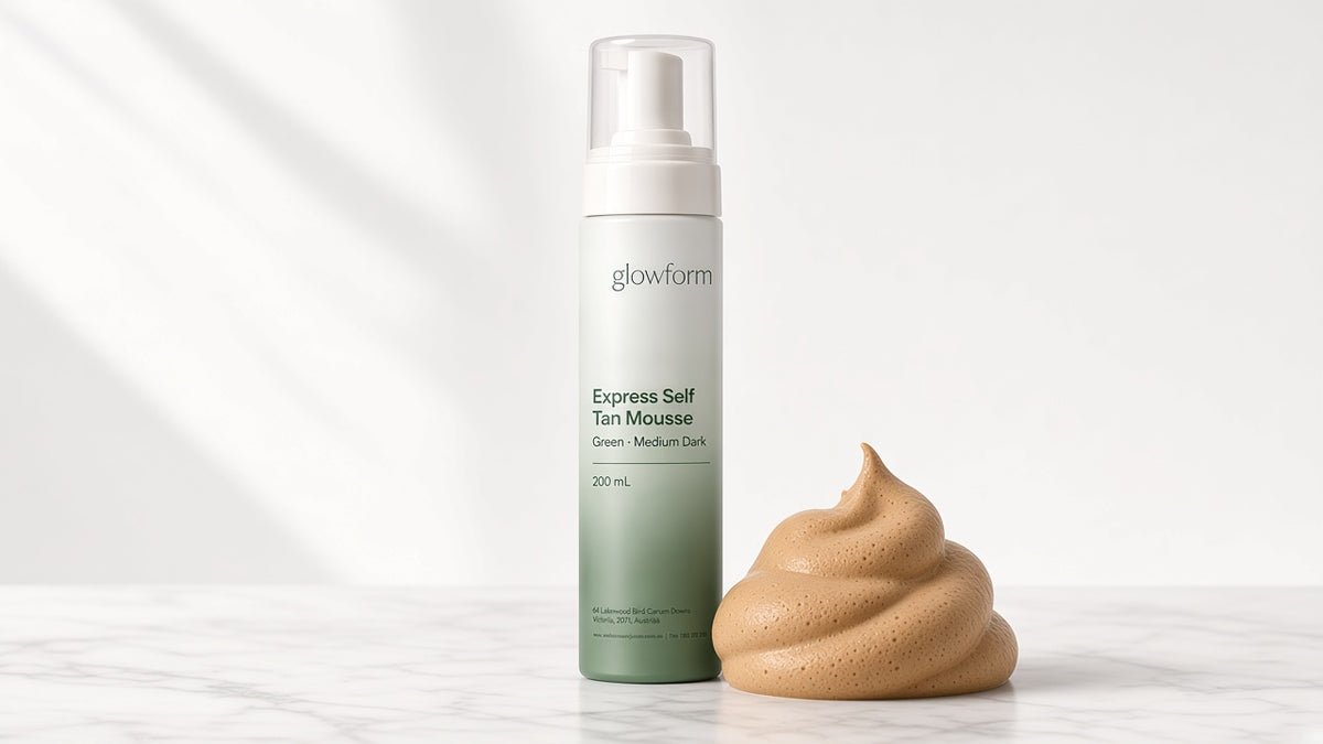A swirl of tan-coloured Glowform mousse beside the green bottle, showing the instant guide colour